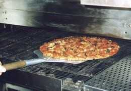 Comment fonctionne un four à pizza à convoyeur ?